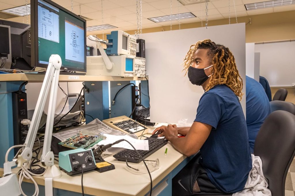 Student working on electronics